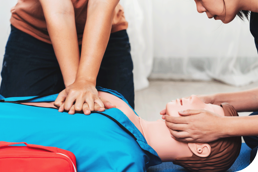 Person performing CPR on a dummy - Shutterstock