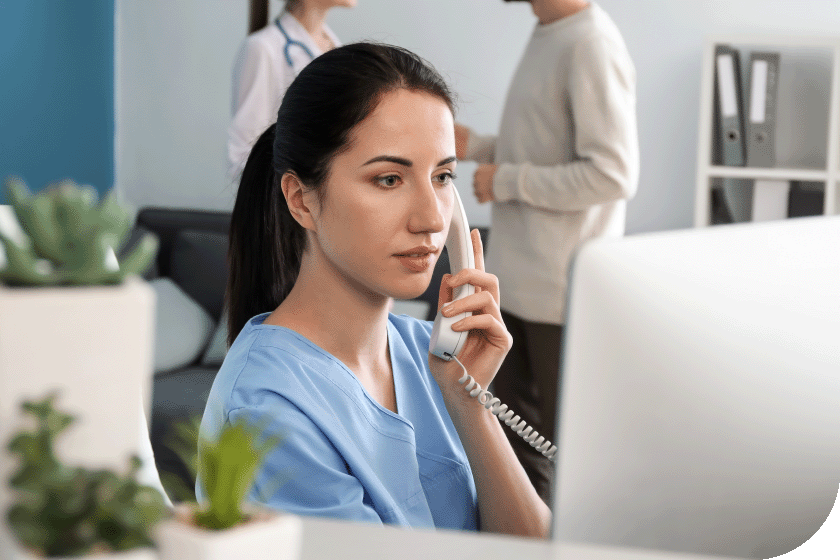  female administration worker on the phone -Shutterstock